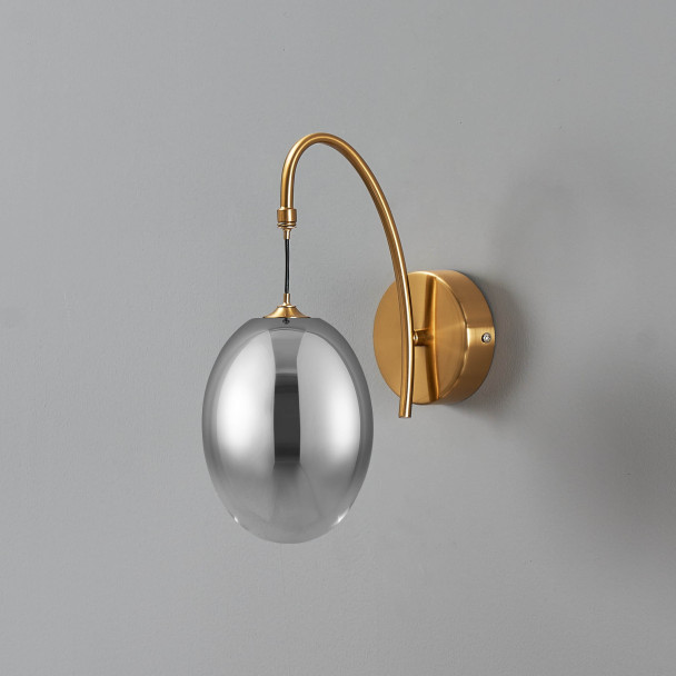 Applique dorée LED en arc avec globe ovale...