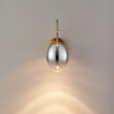 Applique dorée LED en arc avec globe ovale suspendu - Nuvéo