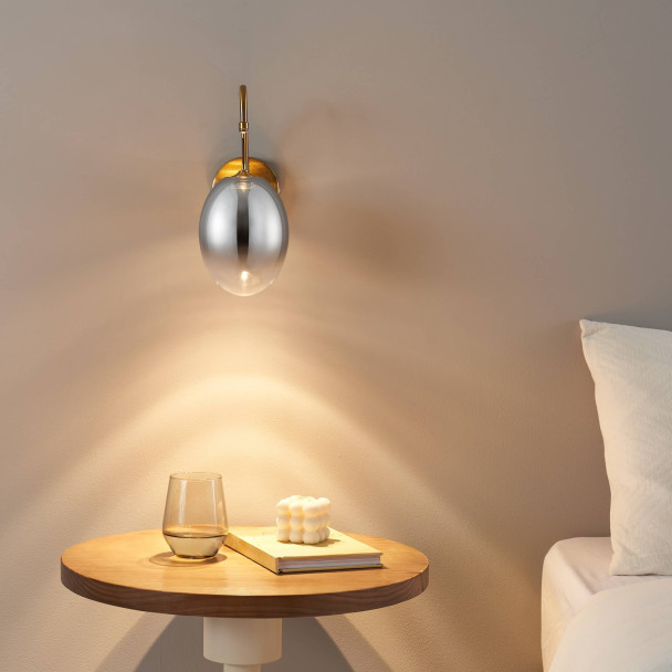 Applique dorée LED en arc avec globe ovale...